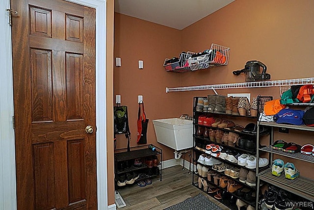 47 Timber Cove Ct, Amherst, NY 14051 - laundry room featuring wood finished floors and a sink