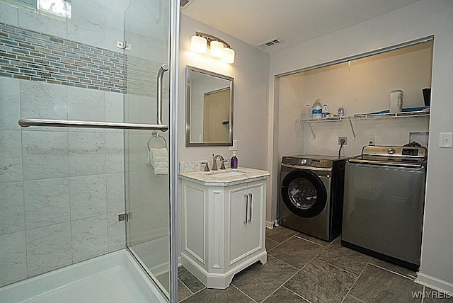 47 Timber Cove Ct, Amherst, NY 14051 - bathroom with a stall shower, washing machine and clothes dryer, and vanity