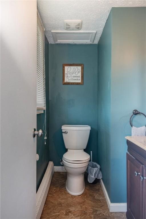 477 Pine Circle Ext, Big Flats, NY 14845 - bathroom featuring a baseboard heating unit, vanity, and a textured ceiling