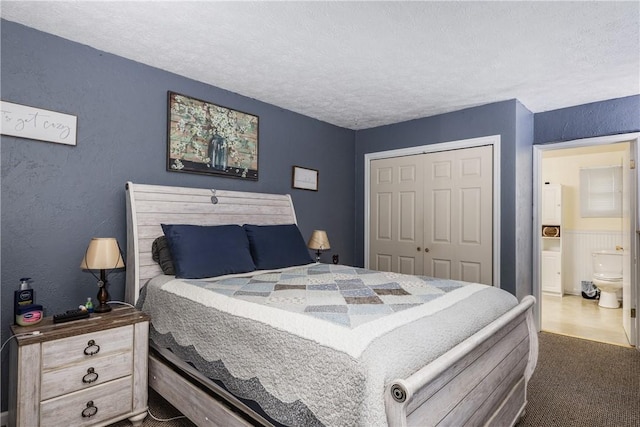 477 Pine Circle Ext, Big Flats, NY 14845 - bedroom featuring a textured ceiling, a closet, dark colored carpet, and a textured wall