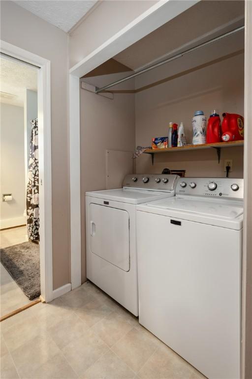 477 Pine Circle Ext, Big Flats, NY 14845 - laundry room with washer and clothes dryer