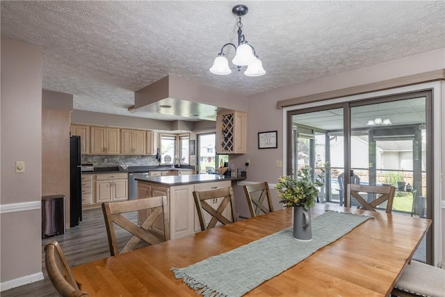 477 Pine Circle Ext, Big Flats, NY 14845 - dining area with a chandelier, dark wood-type flooring, and a textured ceiling