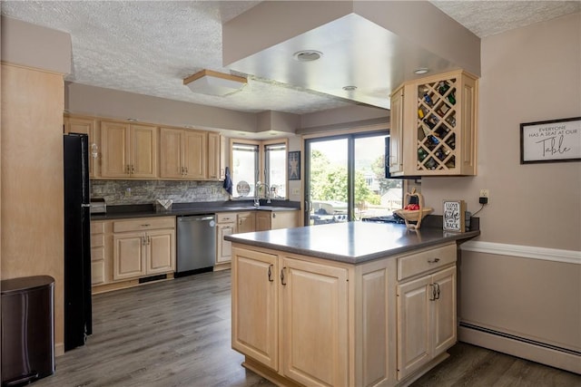 477 Pine Circle Ext, Big Flats, NY 14845 - kitchen featuring stainless steel dishwasher, light brown cabinets, a baseboard radiator, a textured ceiling, and a peninsula