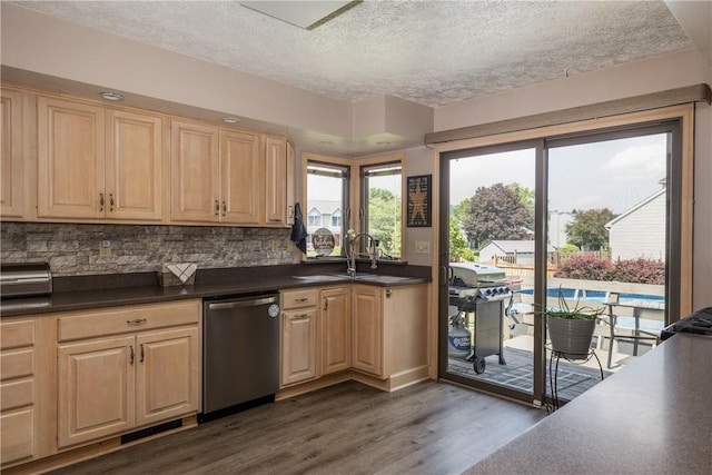 477 Pine Circle Ext, Big Flats, NY 14845 - kitchen featuring dishwasher, light brown cabinets, a textured ceiling, dark wood-style flooring, and dark countertops