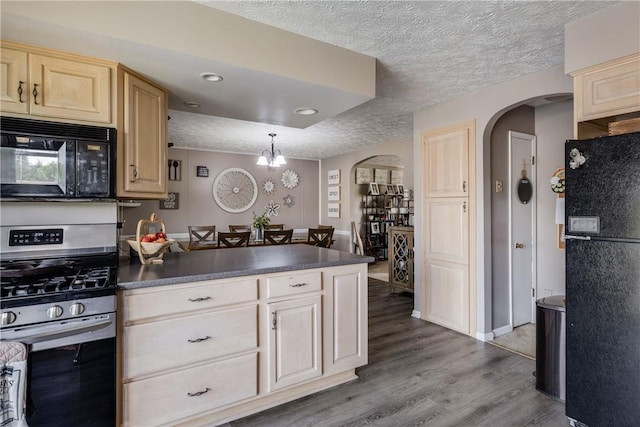 477 Pine Circle Ext, Big Flats, NY 14845 - kitchen with black appliances, arched walkways, light brown cabinets, a peninsula, and a textured ceiling
