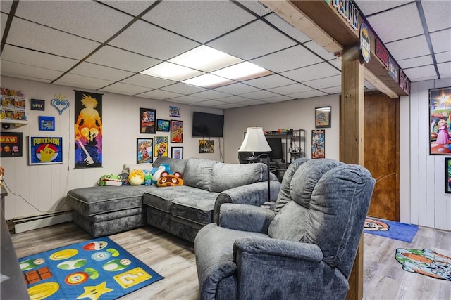 477 Pine Circle Ext, Big Flats, NY 14845 - living area featuring a paneled ceiling, a baseboard radiator, and wood finished floors