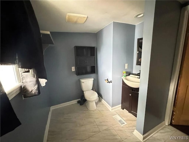 7 High St, Lyons, NY 14489 - bathroom featuring vanity and marble look tile flooring