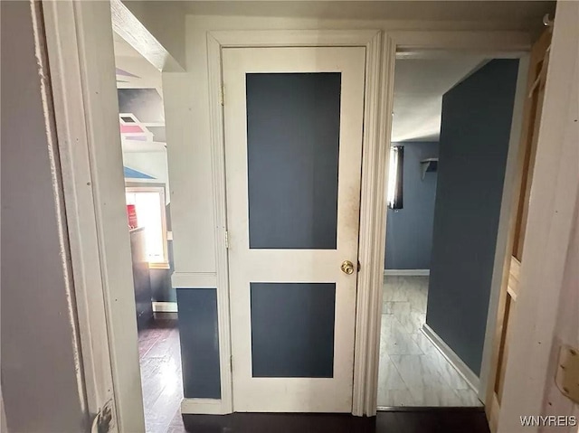 7 High St, Lyons, NY 14489 - hallway featuring baseboards and wood finished floors