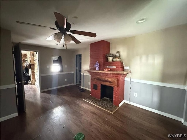 7 High St, Lyons, NY 14489 - living area with a fireplace, ceiling fan, and dark wood-type flooring