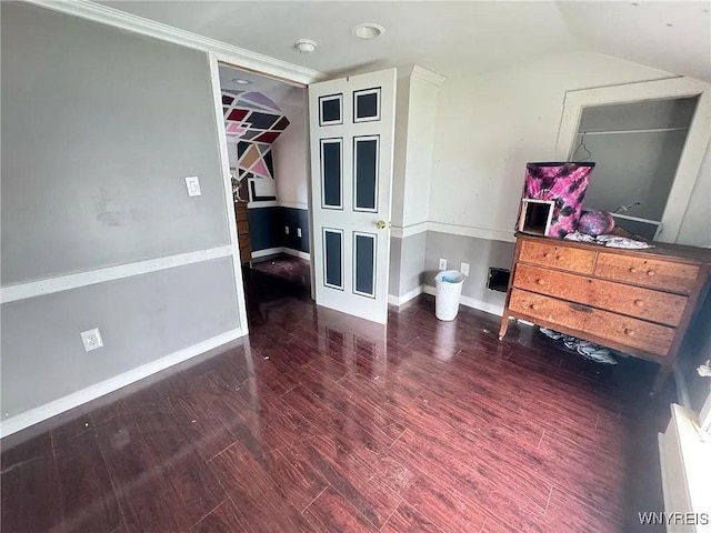 7 High St, Lyons, NY 14489 - bedroom with vaulted ceiling, wood finished floors, and a walk in closet