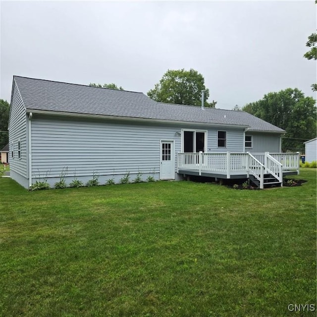 5709 Merry St, Verona, NY 13478 - back of property featuring a deck, a lawn, and roof with shingles