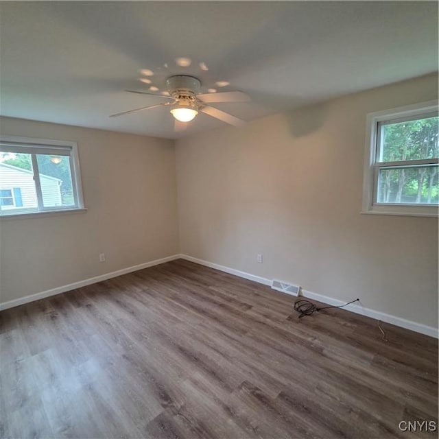 5709 Merry St, Verona, NY 13478 - spare room featuring healthy amount of natural light, a ceiling fan, and wood finished floors