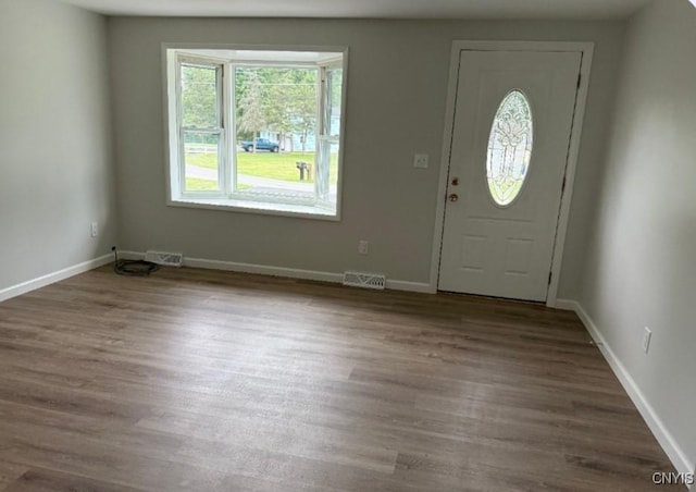 5709 Merry St, Verona, NY 13478 - foyer entrance featuring dark wood-style flooring and baseboards
