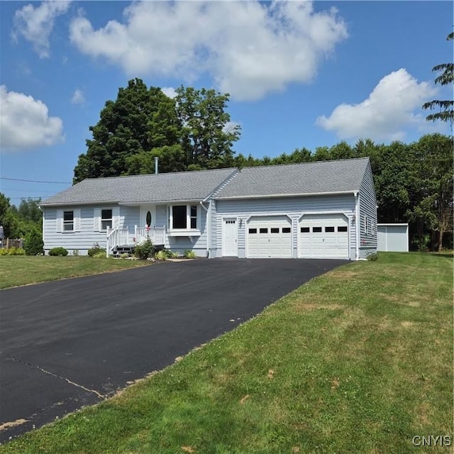 5709 Merry St, Verona, NY 13478 - ranch-style house featuring a garage, a front yard, and driveway