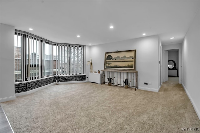 849 Delaware Ave Unit 404, Buffalo, NY 14209 - unfurnished living room featuring carpet and recessed lighting