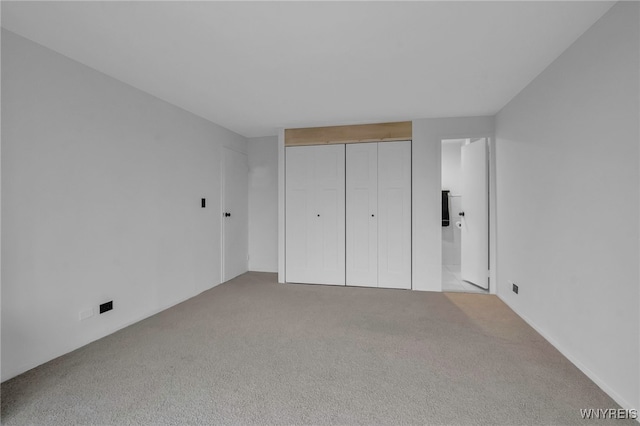 849 Delaware Ave Unit 404, Buffalo, NY 14209 - unfurnished bedroom featuring carpet flooring and a closet