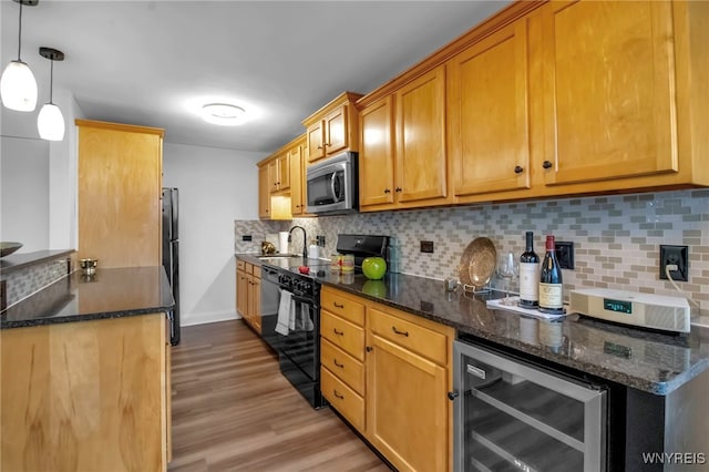 849 Delaware Ave Unit 404, Buffalo, NY 14209 - kitchen featuring black appliances, beverage cooler, light wood finished floors, tasteful backsplash, and dark stone counters