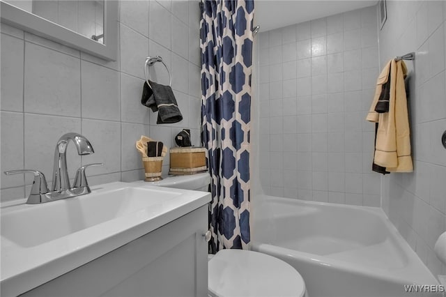 849 Delaware Ave Unit 404, Buffalo, NY 14209 - bathroom featuring shower / tub combo with curtain, tile walls, and vanity