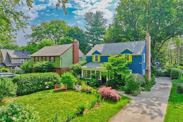 772 Winona Blvd, Irondequoit, NY 14617 - view of front facade with a chimney and concrete driveway