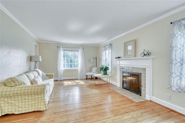 772 Winona Blvd, Irondequoit, NY 14617 - living room with light wood-style flooring, crown molding, and a tile fireplace