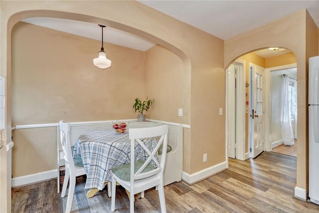 772 Winona Blvd, Irondequoit, NY 14617 - dining area with wood finished floors and arched walkways