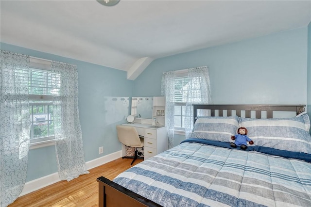 772 Winona Blvd, Irondequoit, NY 14617 - bedroom with wood finished floors, lofted ceiling, and an office area