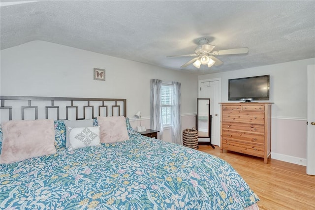 772 Winona Blvd, Irondequoit, NY 14617 - bedroom featuring a textured ceiling, wood finished floors, and a ceiling fan