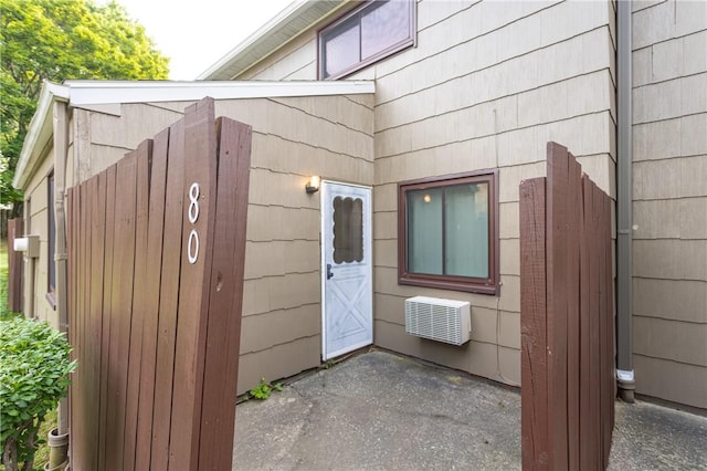 80 Autumn Chapel Way, Chili, NY 14624 - doorway to property with an AC wall unit