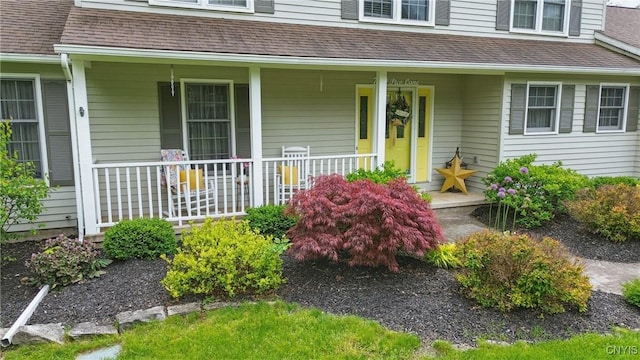 7619 Pico Ln, Lysander, NY 13027 - view of exterior entry with a porch and roof with shingles