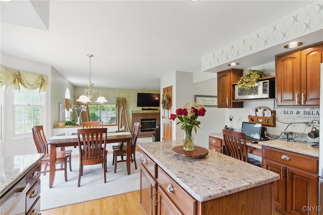 7619 Pico Ln, Lysander, NY 13027 - kitchen with appliances with stainless steel finishes, plenty of natural light, and light stone countertops