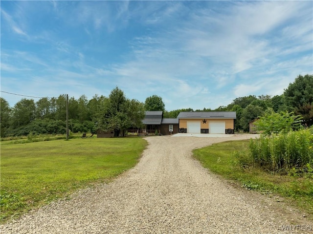 2890 Eagles Nest Rd, Yorkshire, NY 14042 - view of front of property featuring a front lawn, gravel driveway, and a metal roof