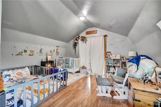 2890 Eagles Nest Rd, Yorkshire, NY 14042 - bedroom with lofted ceiling and wood finished floors
