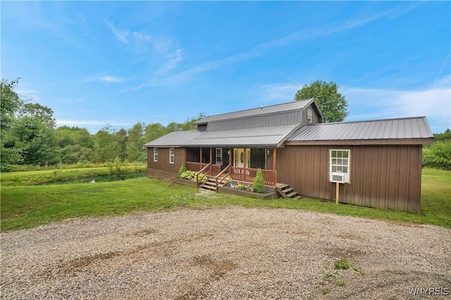 2890 Eagles Nest Rd, Yorkshire, NY 14042 - view of front of home featuring a metal roof, a porch, and a front lawn