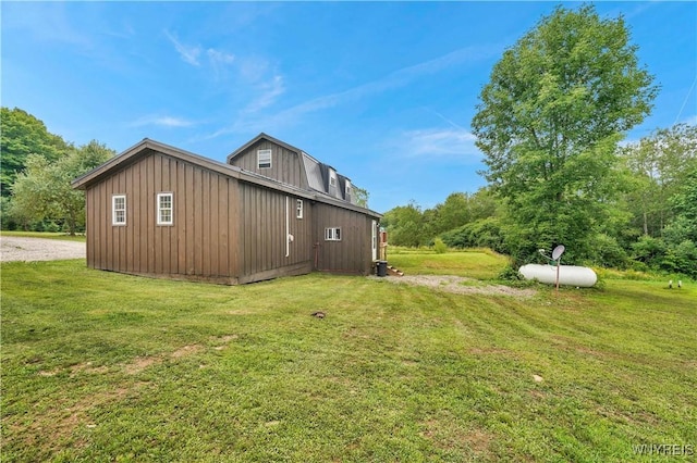 2890 Eagles Nest Rd, Yorkshire, NY 14042 - view of property exterior with a lawn and board and batten siding