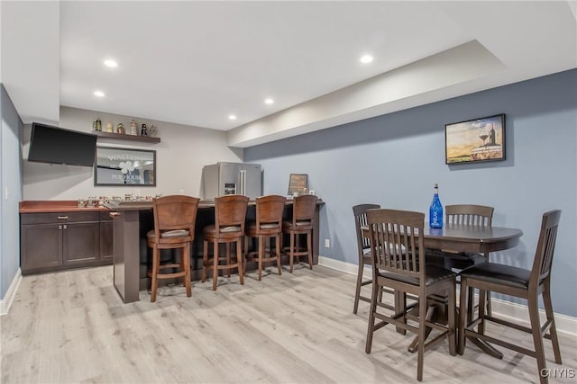 21 Donovan Dr, Oswego, NY 13126 - dining area featuring wet bar, light wood-type flooring, and recessed lighting