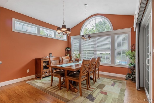 21 Donovan Dr, Oswego, NY 13126 - dining space featuring a chandelier, light wood-type flooring, and vaulted ceiling