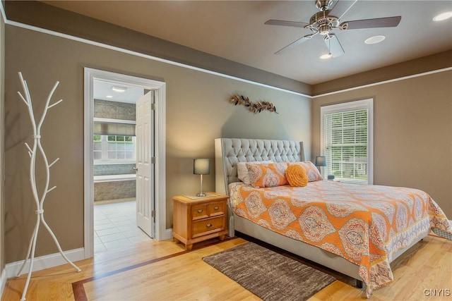 21 Donovan Dr, Oswego, NY 13126 - bedroom with light wood-type flooring, connected bathroom, recessed lighting, and a ceiling fan