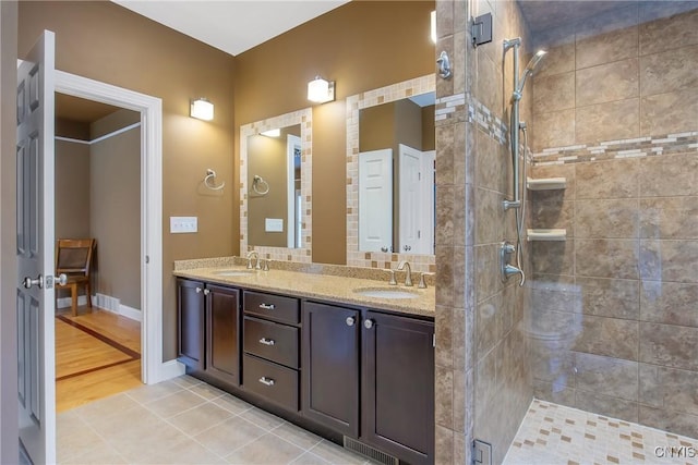 21 Donovan Dr, Oswego, NY 13126 - bathroom with double vanity and a stall shower