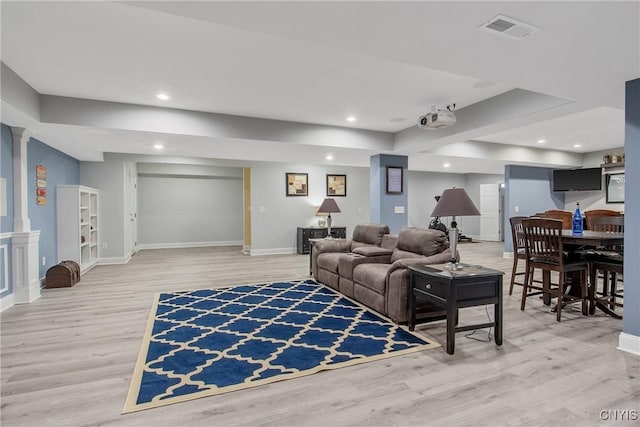 21 Donovan Dr, Oswego, NY 13126 - living room featuring light wood-style flooring, recessed lighting, and ornate columns