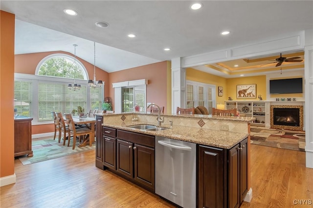 21 Donovan Dr, Oswego, NY 13126 - kitchen featuring stainless steel dishwasher, open floor plan, ceiling fan, light wood-type flooring, and dark brown cabinets