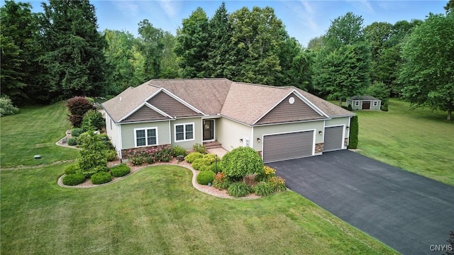 21 Donovan Dr, Oswego, NY 13126 - view of front of home with an attached garage, stone siding, asphalt driveway, and a front lawn