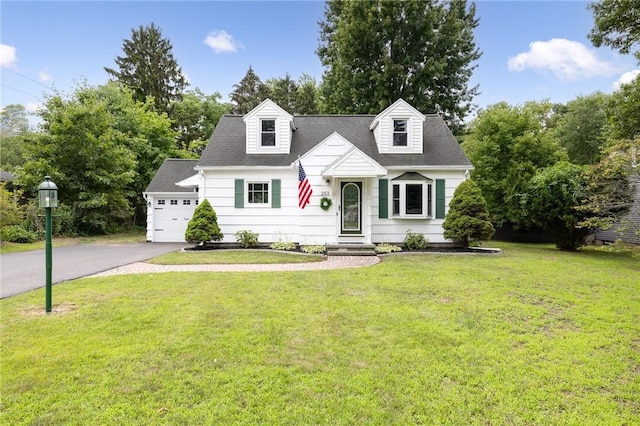 263 Volk Rd, Webster, NY 14580 - cape cod-style house featuring asphalt driveway, a front yard, a garage, and a shingled roof