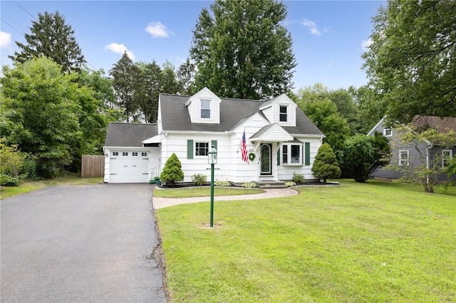 263 Volk Rd, Webster, NY 14580 - cape cod-style house with asphalt driveway, a garage, and roof with shingles