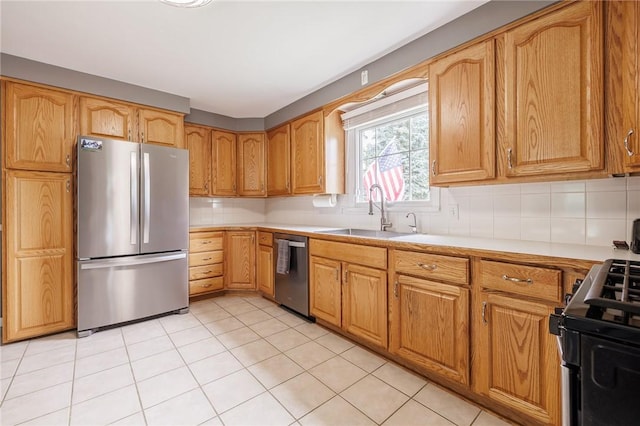 263 Volk Rd, Webster, NY 14580 - kitchen featuring stainless steel appliances, decorative backsplash, light countertops, and light tile patterned floors