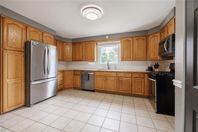 263 Volk Rd, Webster, NY 14580 - kitchen with stainless steel appliances, brown cabinets, light countertops, and decorative backsplash