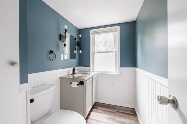 263 Volk Rd, Webster, NY 14580 - bathroom featuring a wainscoted wall, vanity, and wood finished floors