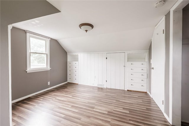 263 Volk Rd, Webster, NY 14580 - additional living space with wood finished floors and vaulted ceiling