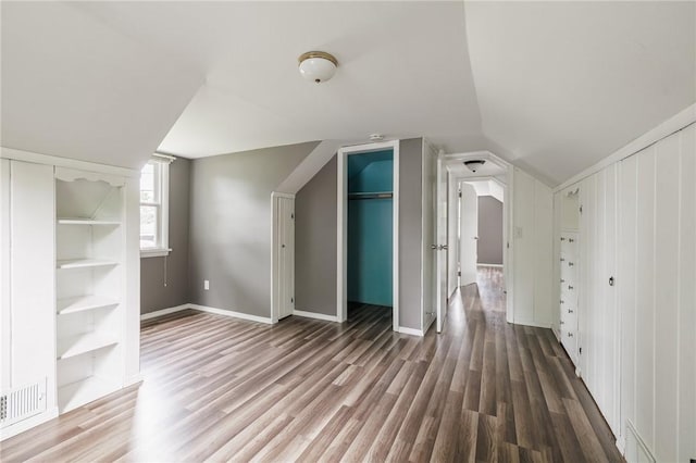 263 Volk Rd, Webster, NY 14580 - additional living space featuring wood finished floors and lofted ceiling