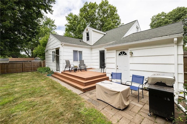 263 Volk Rd, Webster, NY 14580 - back of property with a deck, a shingled roof, and a patio area