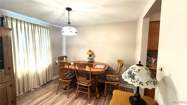 1330 Maple Rd Unit 4, Amherst, NY 14221 - dining space featuring light wood-style flooring and baseboards